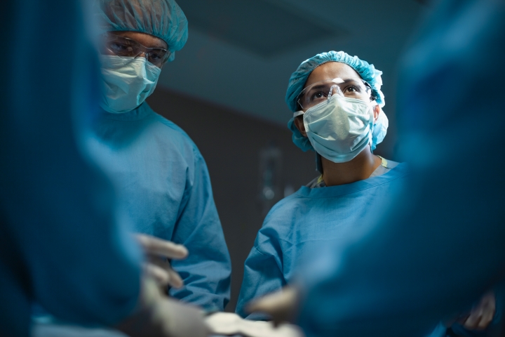 operating room surgeons in scrubs preparing for surgery while relying on Casechek’s bill-only healthcare solutions to improve patient satisfaction